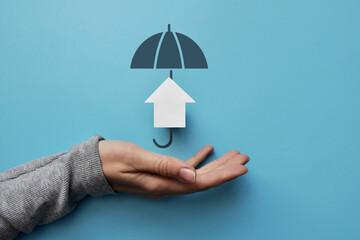 The silhouette of an umbrella and a house under it. Housing Insurance Symbol