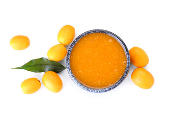 Bowl of tasty kumquat jam and fresh fruits on white background