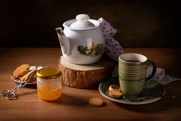 Still life with hot tea and honey on the table