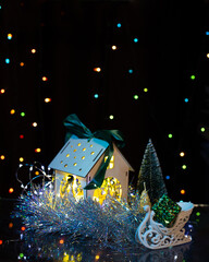 Christmas still life with a house and bright lights