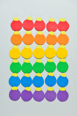 Creative rainbow Christmas balls on light background