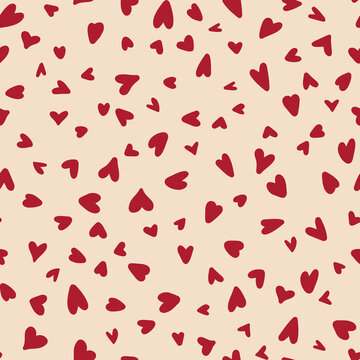 Hand drawn hearts seamless repeat pattern. Random placed, vector love sing elements all over surface print on beige background.