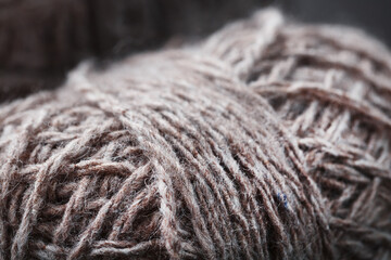 Light brown wool yarn made of threads in tangles.