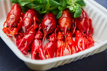 River Cooked Red Crawfish. Boiled crayfish with dill on wooden background