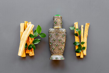 Agar wood oil fragrances or arabian oud perfume with sticks of tree