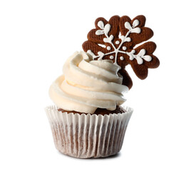 Tasty Christmas cupcake with gingerbread cookie on white background