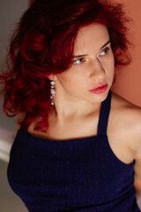 portrait of a red-haired girl in a coupe plan