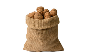 Walnut in a burlap sack on a white background. Natural ingredient.