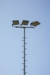 Pole with lanterns. Lighting in the stadium.
