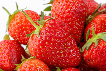 beautiful and ripe red strawberries on a white background