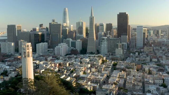 Aerial video footage of San Francisco, California. Buildings lit by golden light of sunset.