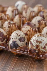 Quail eggs on the wooden plate. Quail eggs can be consumed by frying or boiling. In Indonesia quail eggs called telur puyuh.