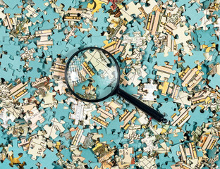Puzzle pieces mess and chaos through magnifying glass. Missing jigsaw part. Research concept.