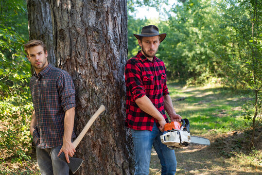 Brutal lumberjacks. Cutting wood. Brutality and masculinity. Lumberjack style. Man woodcutter with axe. Man with axe.