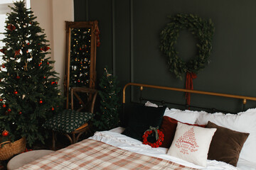 Christmas interior with Christmas tree and bed