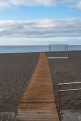 The wooden pathway on Las Playitas beach on an early cloudy morning.
