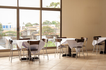 interior of restaurant with tables and chairs