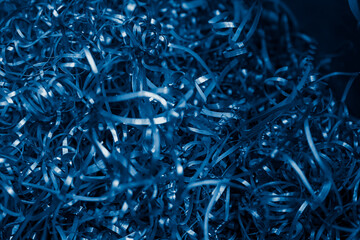 blue steel shavings with visible details. background or texture