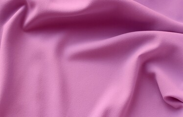 Calm pink satin background. Silk fabric with pleats. Satin, silk or satin create a beautiful drapery. Fashion design.