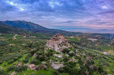 Fototapeta na wymiar Aerial view of the Castle of Vatika or Castle of Agia Paraskevi at sunset. The castle is located in Mesohori village and has a wonderful view of Neapolis town and Elafonissos island, Laconia, Greece.