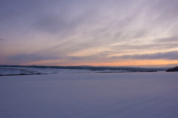 Fototapeta na wymiar Northern steppe with snow. Sunrise.