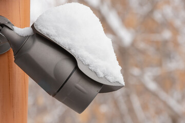 The CCTV camera is covered with snow in winter.