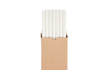 Mockup image of white drinking paper straws in kraft paper box isolated on white background. Biodegradable drinking straws. Sustainable lifestyle and zero waste concept