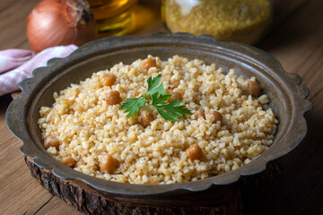 Traditional delicious Turkish food; bulgur pilaf with chickpea (Turkish name; nohutlu bulgur pilavi)