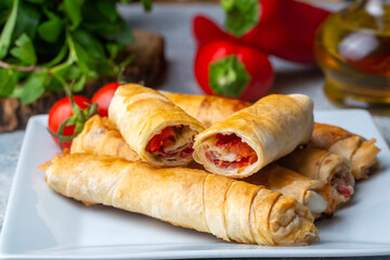 Turkish Pacanga Boregi with pastirma (pastrami) and cheddar (melted) cheese. - Pastirmali Borek