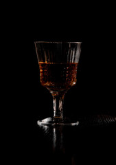 whiskey in a glass in the dark