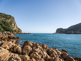 Knysna lagoon's east and west heads and rocky beach in the Garden Rout South Africa