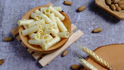Christmas cake, wafer roll stick on wooden bowl, Food Phtotography, Food and beverage concept.