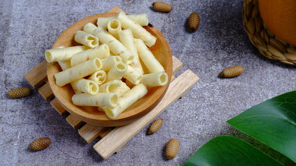 Christmas cake, wafer roll stick on wooden bowl, Food Phtotography, Food and beverage concept.