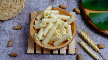Christmas cake, wafer roll stick on wooden bowl, Food Phtotography, Food and beverage concept.
