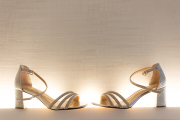 bride wedding shoes with dramatic lighting 