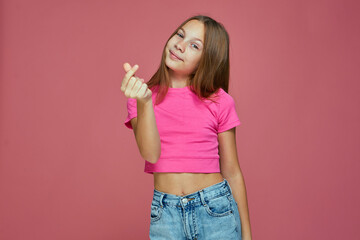 Cash gesture. Cute child girl ask payment, financial reward, debt or donation on pink background. Children pocket money