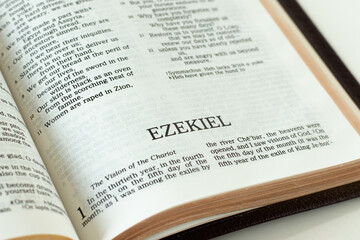 Ezekiel open Holy Bible Book. A close-up. Studying Old Testament prophesy from Scripture. Christian...