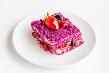 Forest fruit cake on a white background. Turkish sweet dessert concept. plate of sliced forest fruit cake. Mediterranean bakery. close up. selective focus. Horizontal view.