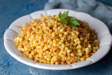 Traditional delicious Turkish food; Couscous pilaf with vermicelli (Turkish name; Sehriyeli kuskus pilavi)