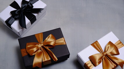 Cute gift box with satin ribbon on the table. Christmas and new year concept, Valentine Concept. Copy space, Negative Space. High View.