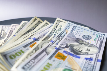 US Dollars bills on the gray plate