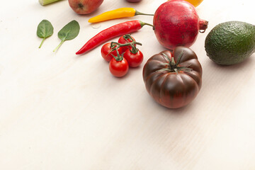 various fruits and vegetables on white wooden background