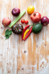 fruits and vegetables on light wooden background