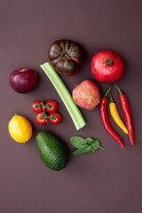 fruits and vegetables on brown background