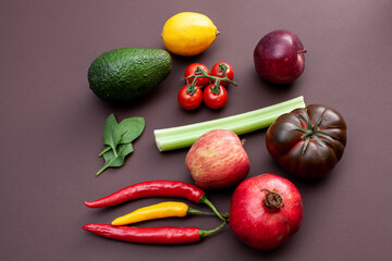 various fruits and vegetables on brown background