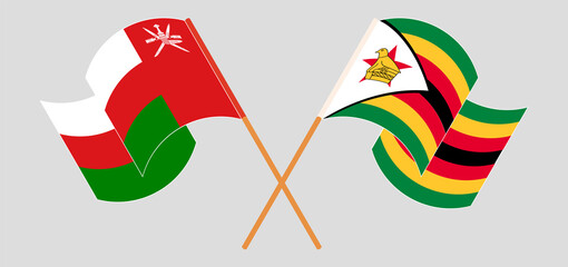 Crossed flags of Oman and Zimbabwe. Official colors. Correct proportion
