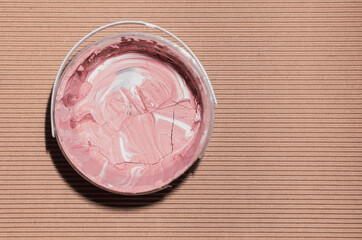 Dried paint in a plastic jar