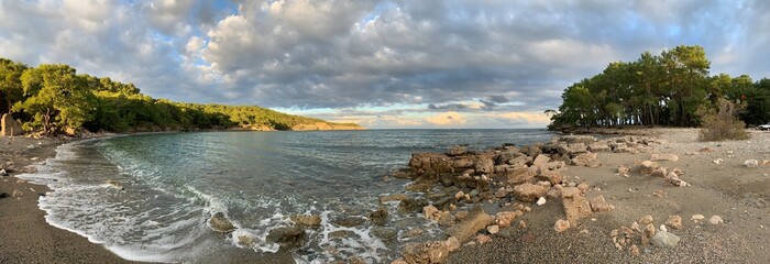 Fototapeta na wymiar Phaselis Greek and Roman city on the coast of ancient Lycia. Harbour panoramic view. Tekirova, Antalya, Turkey