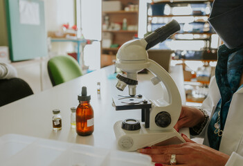 Scientist preparing solutions and analyzing the results of chemical reactions in his laboratory.