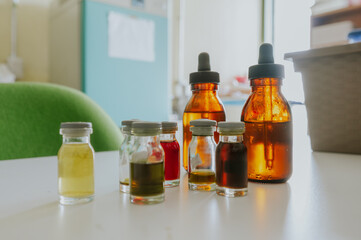 Laboratory glassware, such as flasks, test tubes with different chemicals in a laboratory.